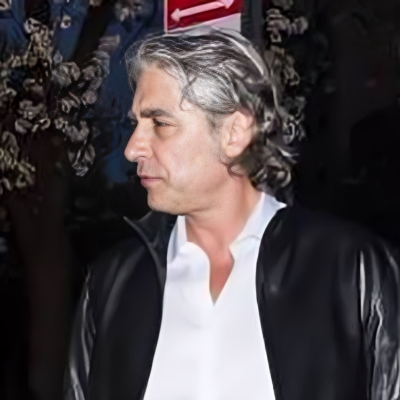 Harvard graduate, Peter Palandjian walking from an event.